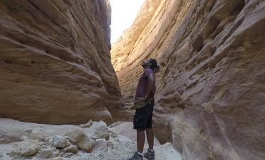 man about to climb rocks